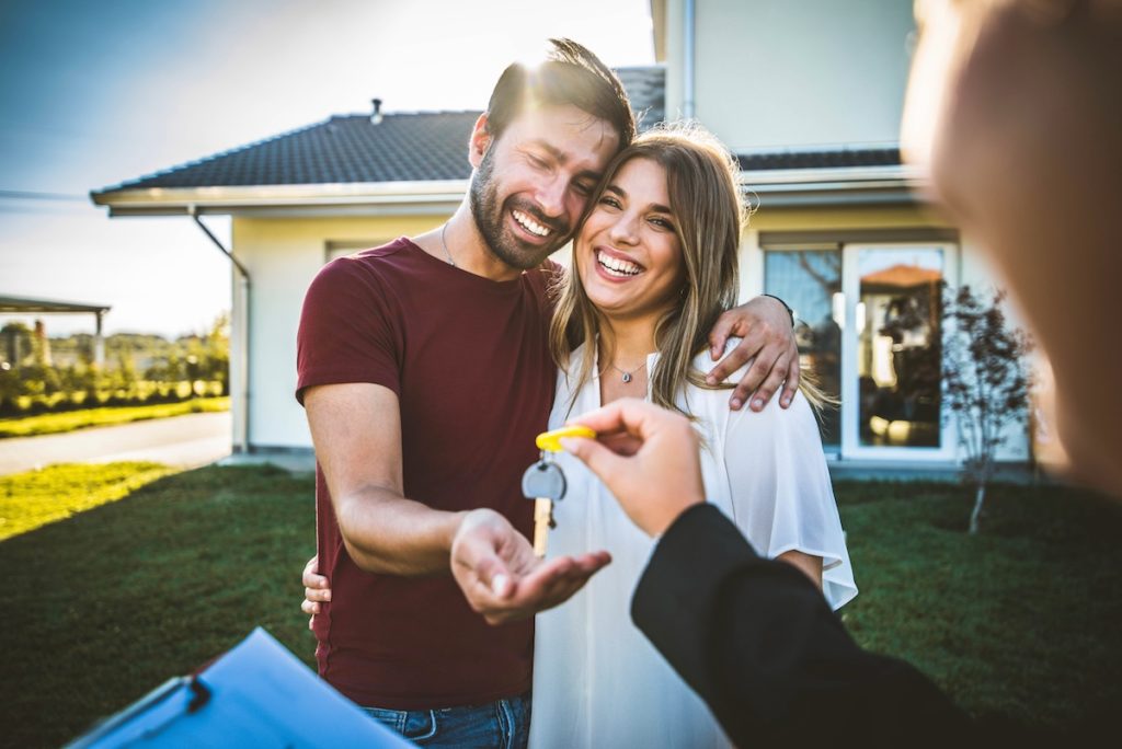 Happy couple buying home